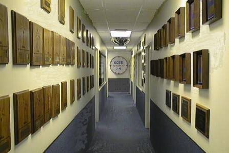 WOW! A picture of the hallway leading to the newsroom and the KCBS studios, with lots of awards on the walls and the cool KCBS clock that was used in the TV commercial_jpg - 36K